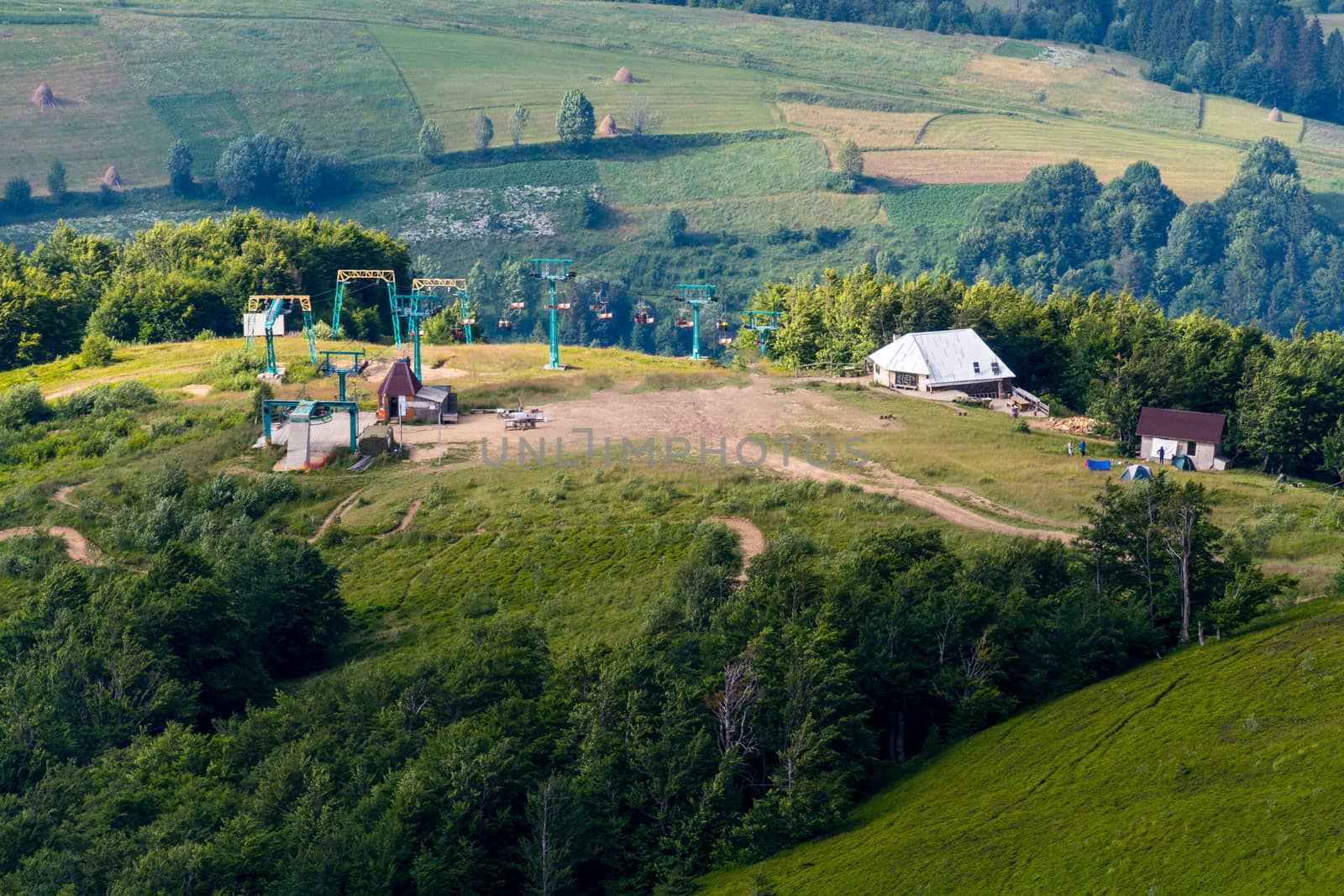 The cable car and the adjacent fields and houses