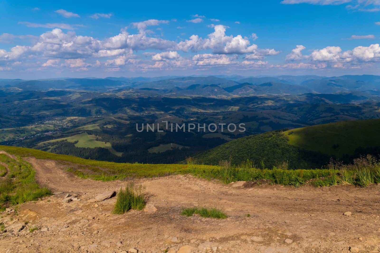 Plain with dry land with an excellent view of the green mountains, hills and valleys