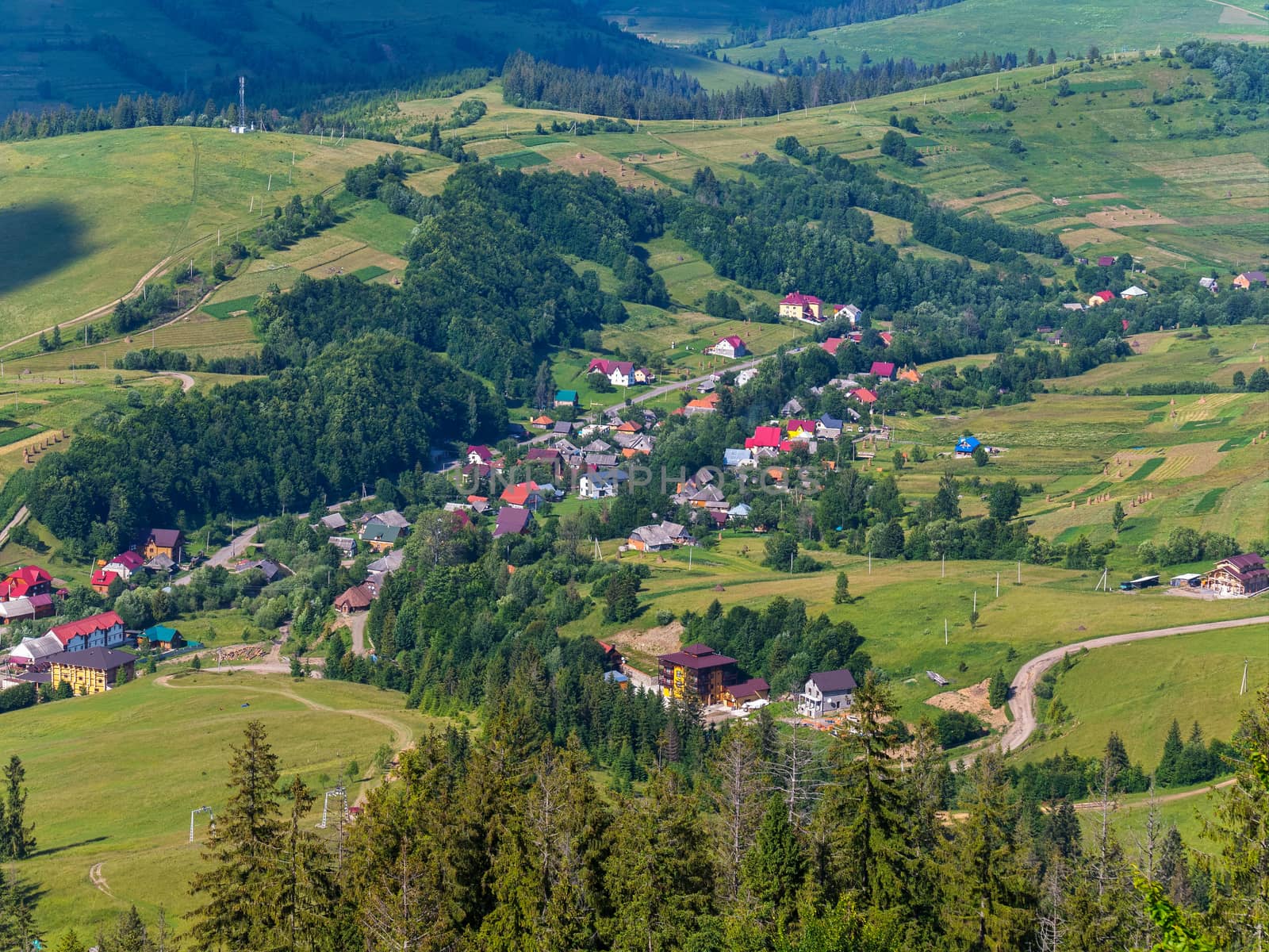 Small villages with lovely beautiful houses among green trees and vast mountains