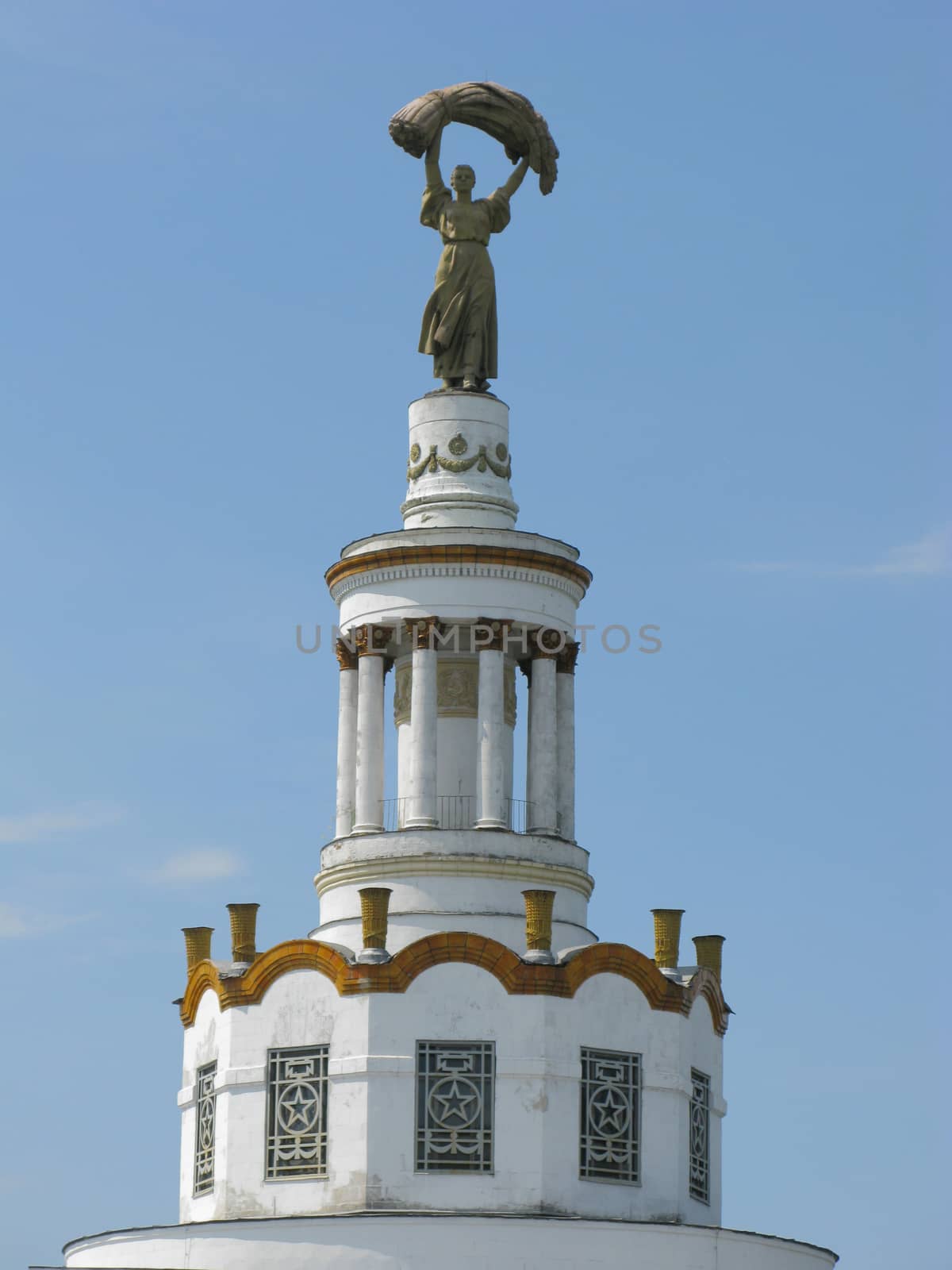 The monument on which is depicted a woman with a stack of wheat. Symbol of harvest and bread as the main gastronomic product by Adamchuk