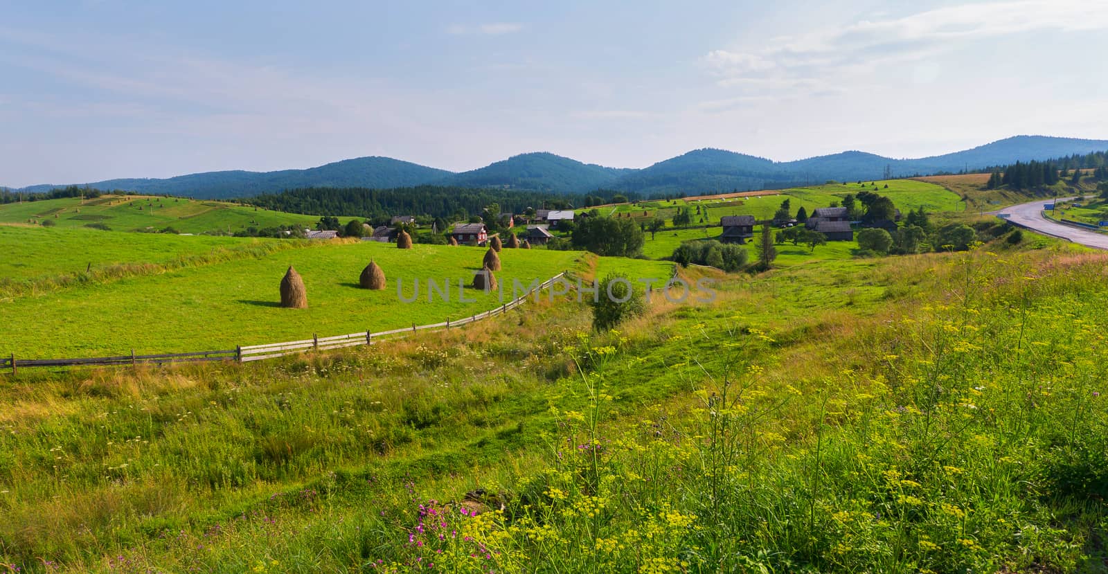 A small village on a picturesque place in the midst of the vast meadows and green mountains