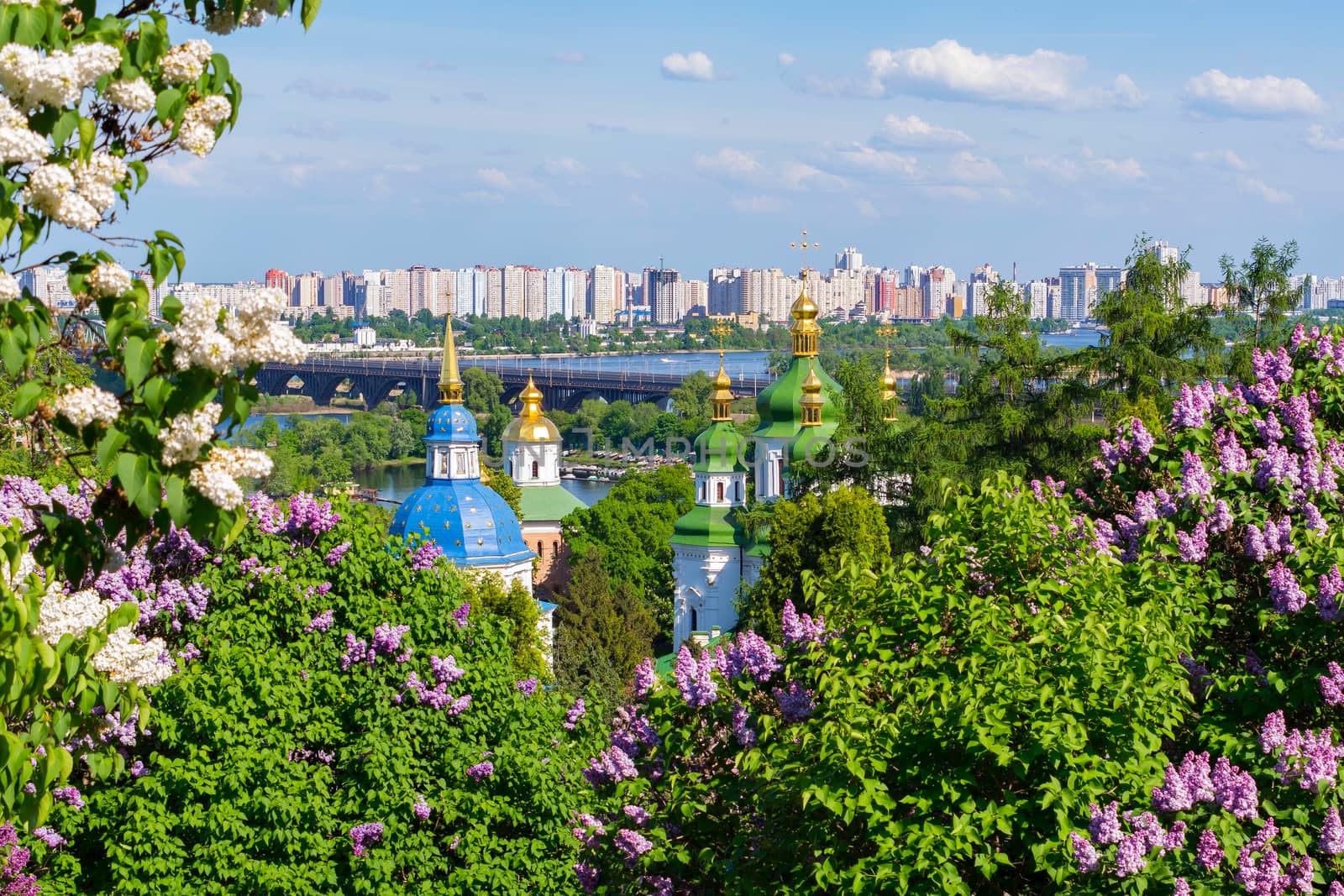 Scenic view of the golden-domed church temples and the bridge over the river