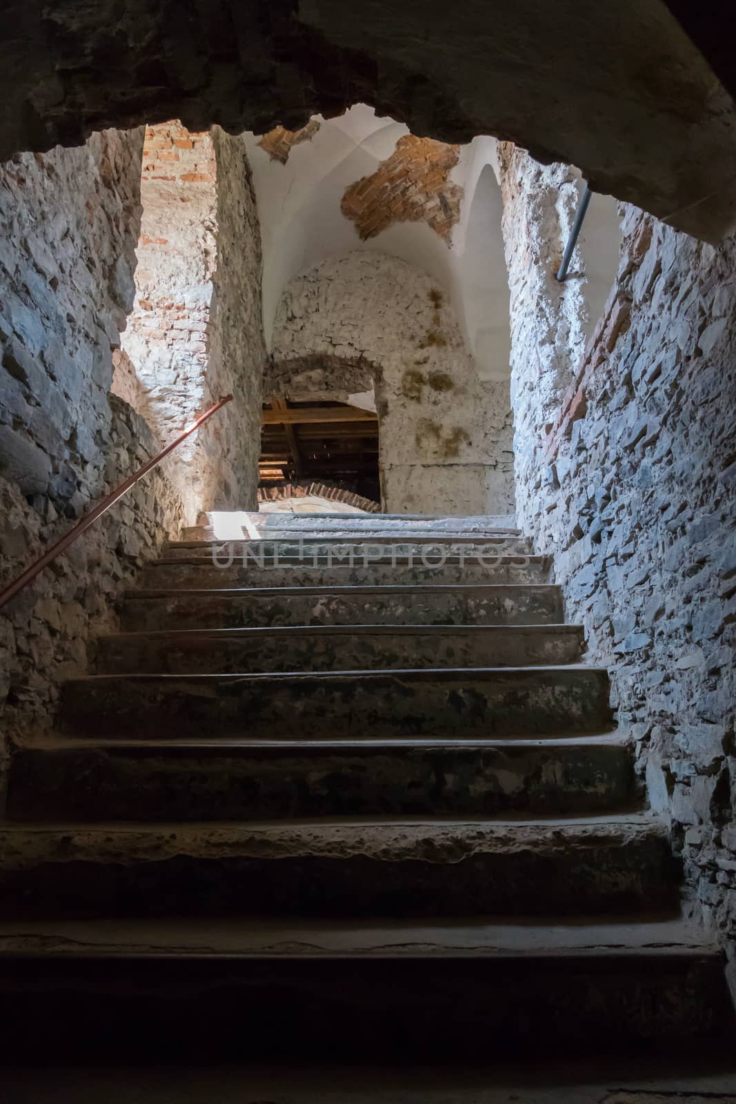 dilapidated steps in an ancient stone building