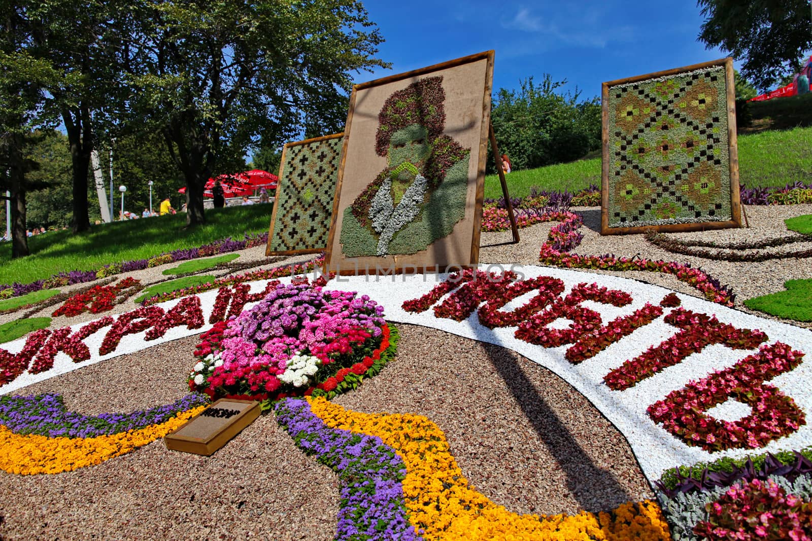 portraits of the poet embroidered with ornament on a designer lawn