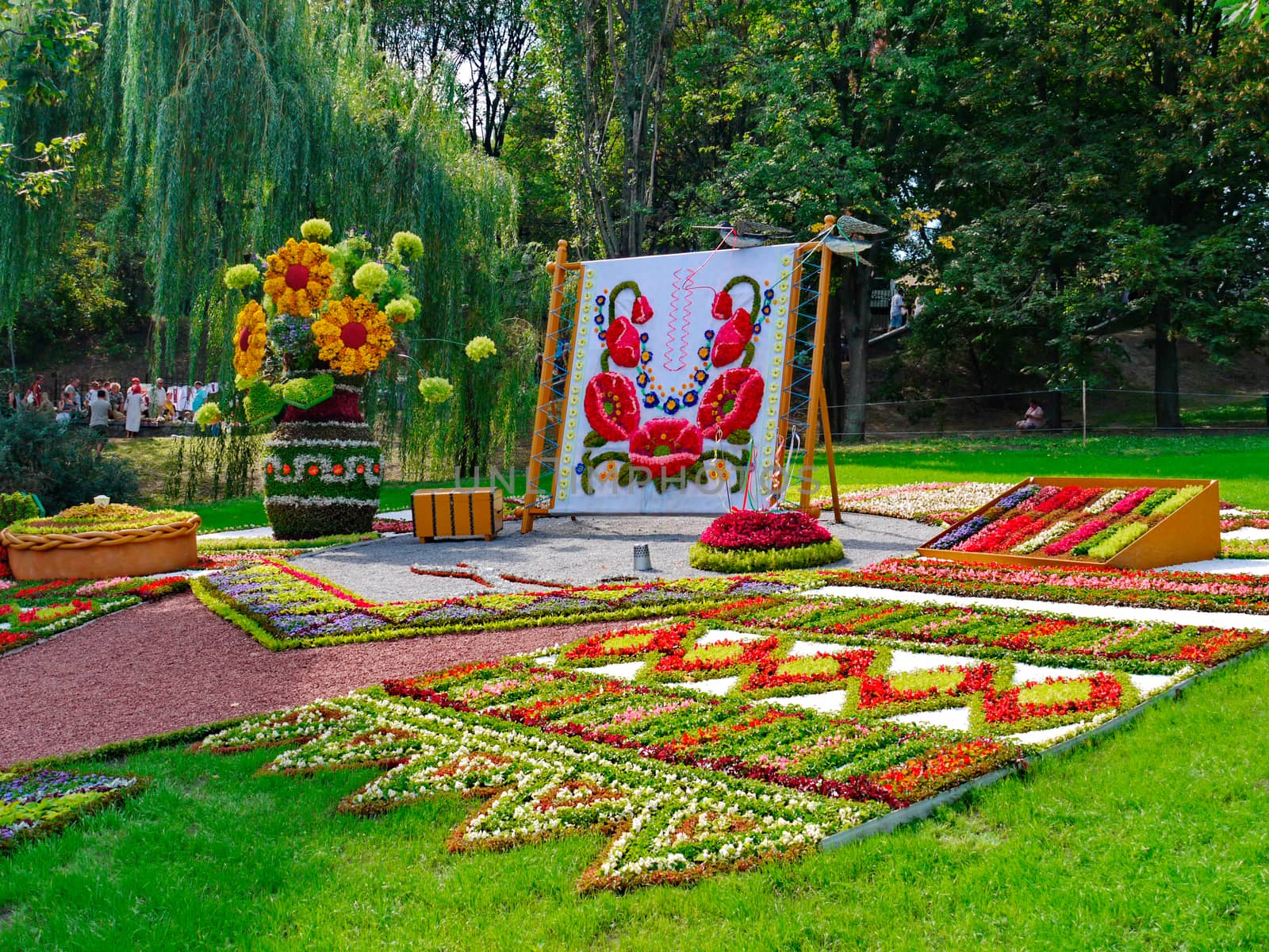 Beautiful flowerbed with sculptures made of a flower on it