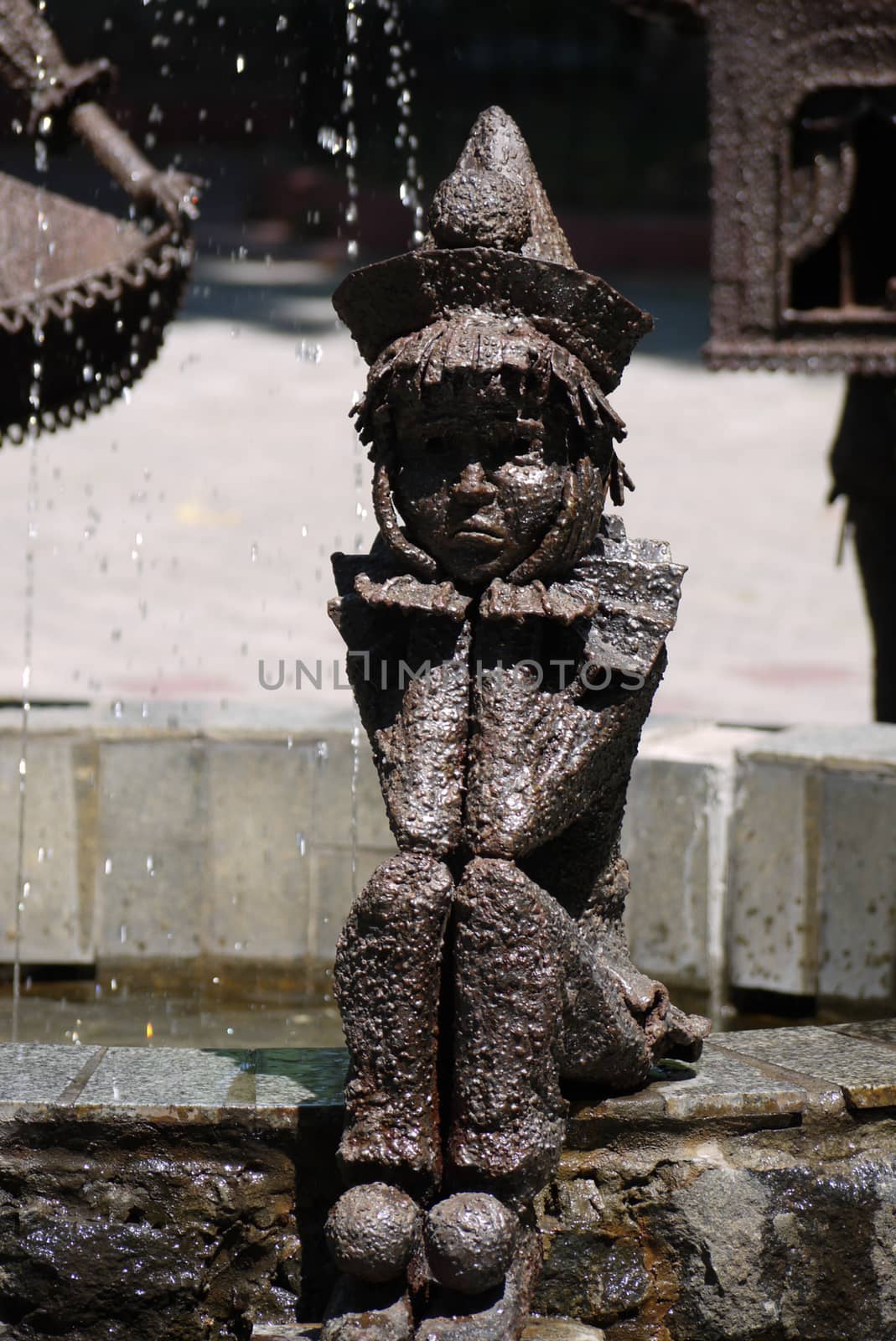 Monument to the sad Pierrot propping up his puffed cheeks and sad face