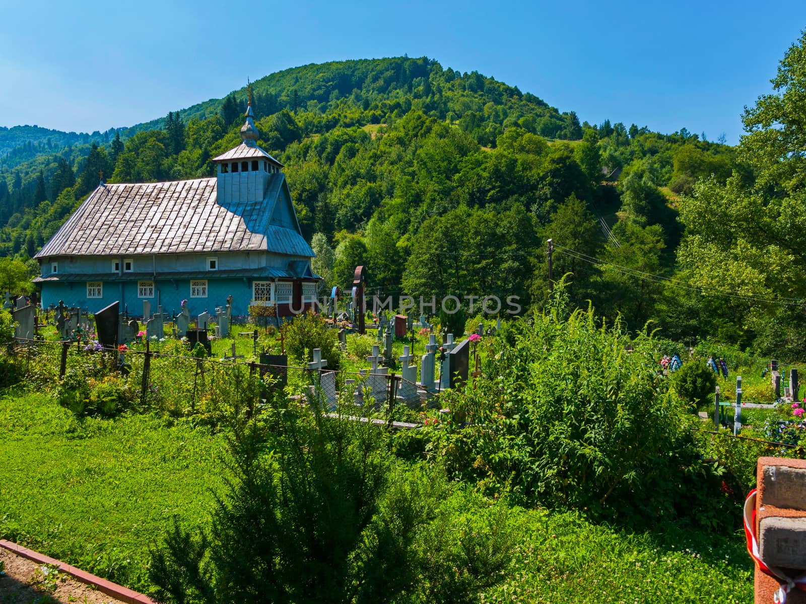 old cemetery near the village wooden church in the Carpathians on the mountain