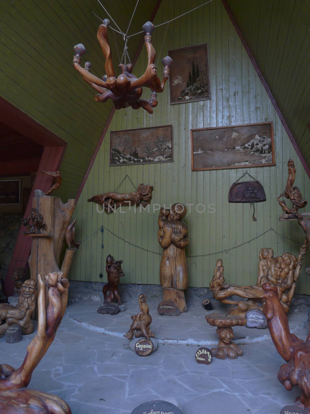 Museum eexponies in the form of wooden carved figures of people and animals