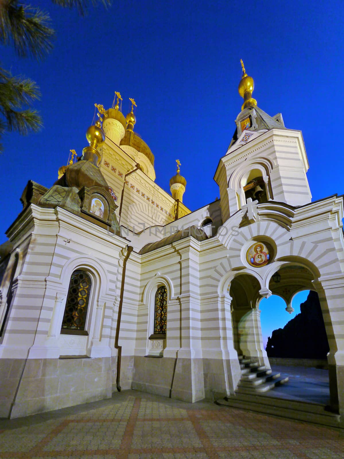Arch with stairs leading to the entrance to the beautiful church church
