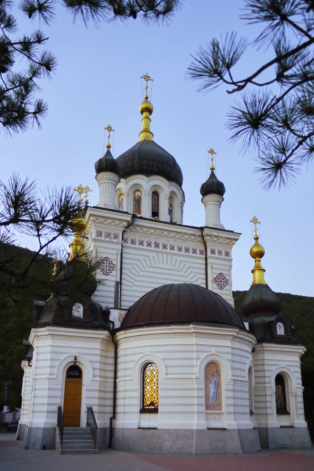 neat church with white walls located in a quiet and well-tended place