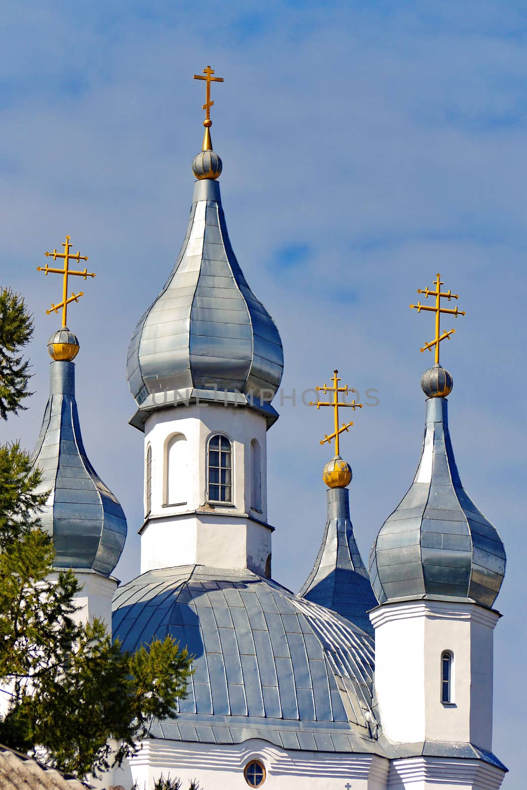 strict and at the same time beautiful features of the church with white walls and shining domes