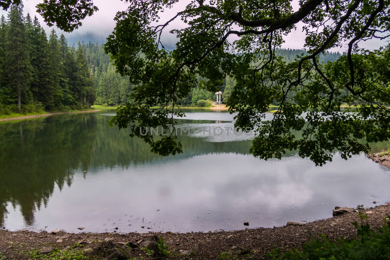 A commemorative sign on the opposite shore of the lake by Adamchuk