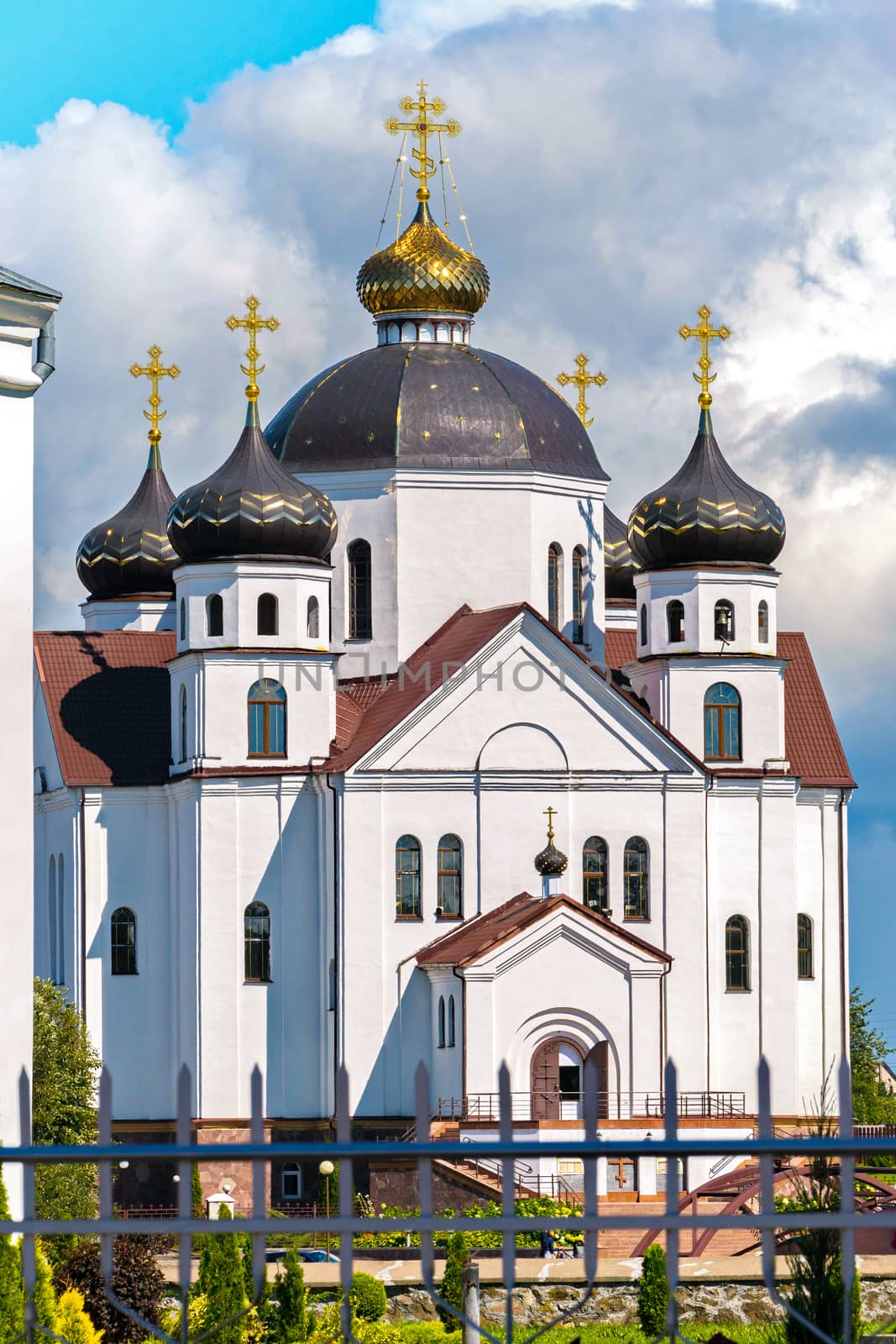 view from behind the fence on the cathedral with five domes