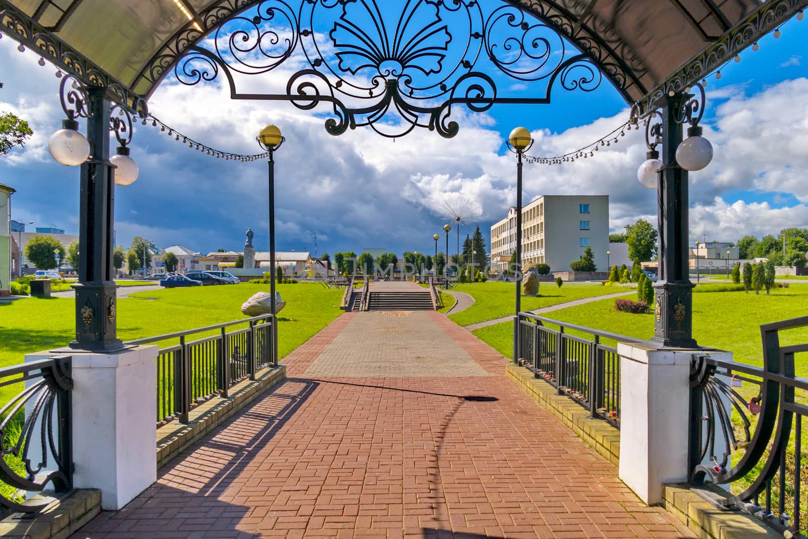 A beautiful canopy with figured railing with an exit directly to the park