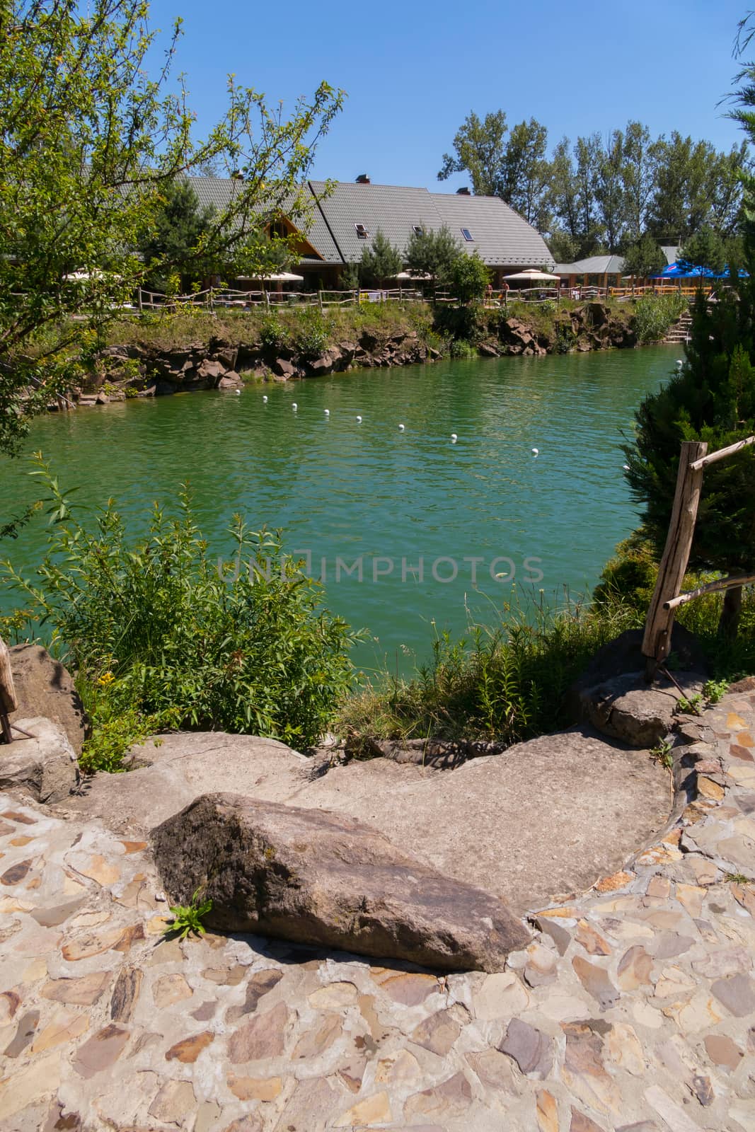 Desert man-made pond in the park for a rest in the midday heat by Adamchuk