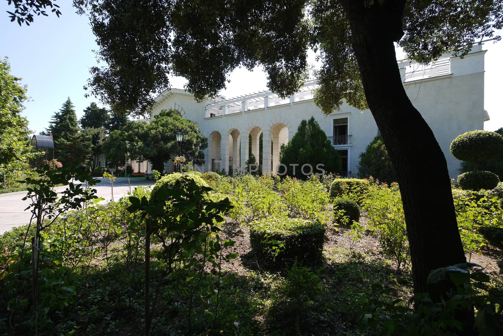 white wall with arches in the park. Place for walks