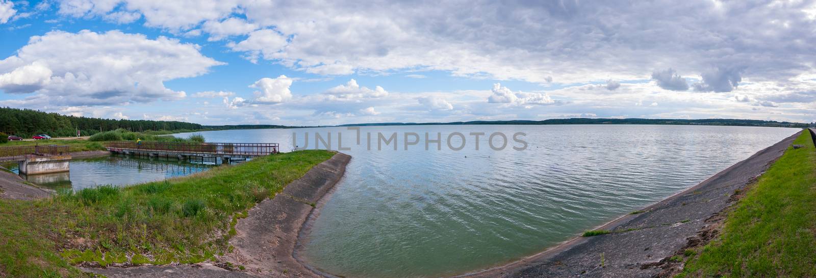 A delightful panorama of the lake with clouds floating unhurriedly over it by Adamchuk