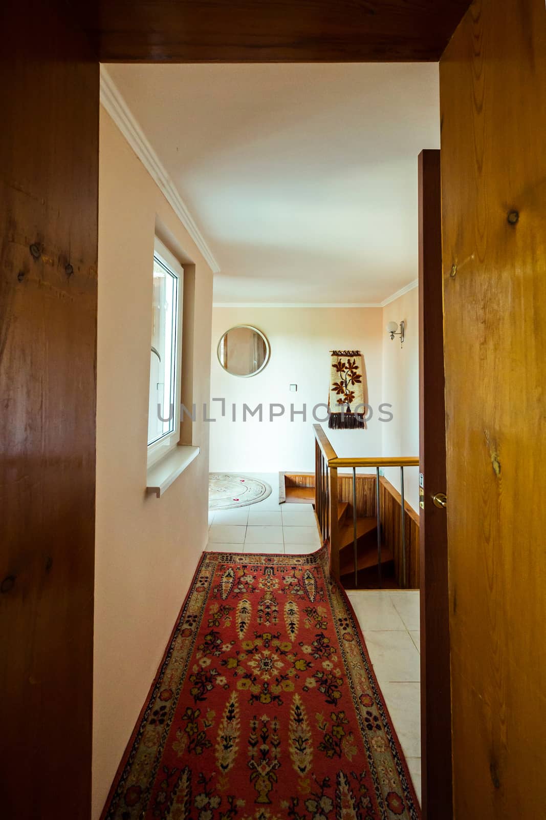 A small corridor in the room with a track on the floor leading to the steps along which you can go down to the floor below. by Adamchuk