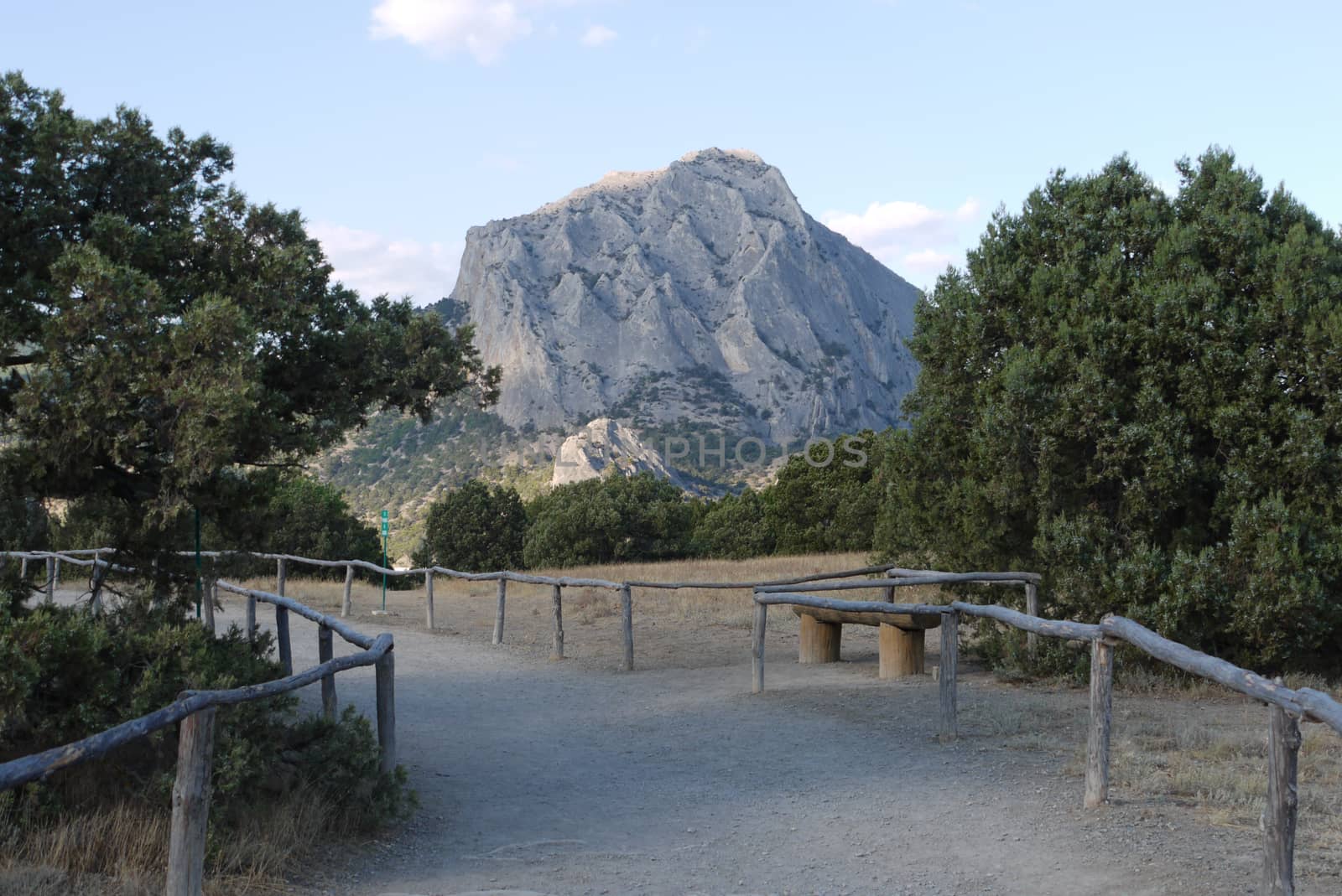 walkway for tourists on the background of a small mountain range