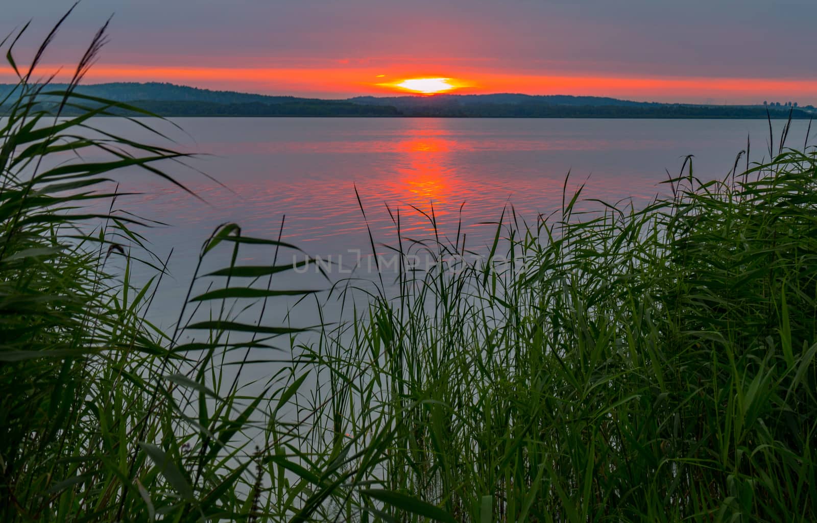 calm sea on the background of a beautiful fire sunset