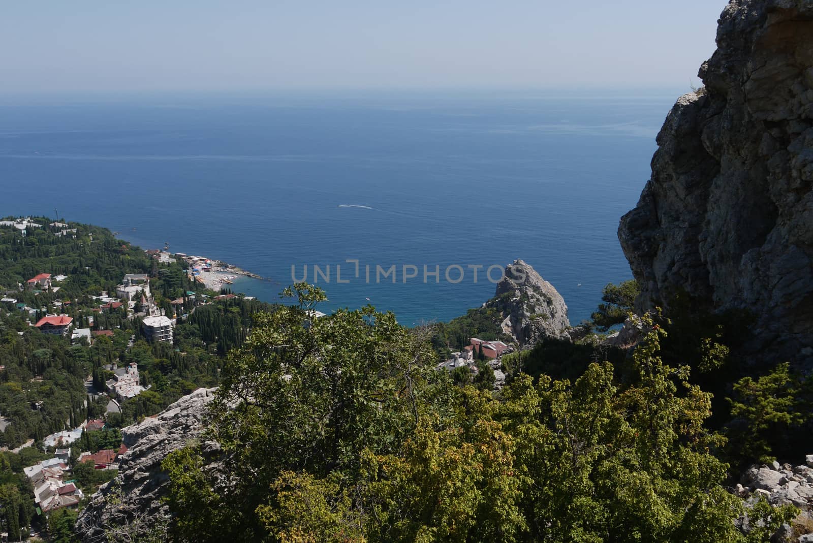 a small cozy coastal town on the background of the boundless Black Sea by Adamchuk