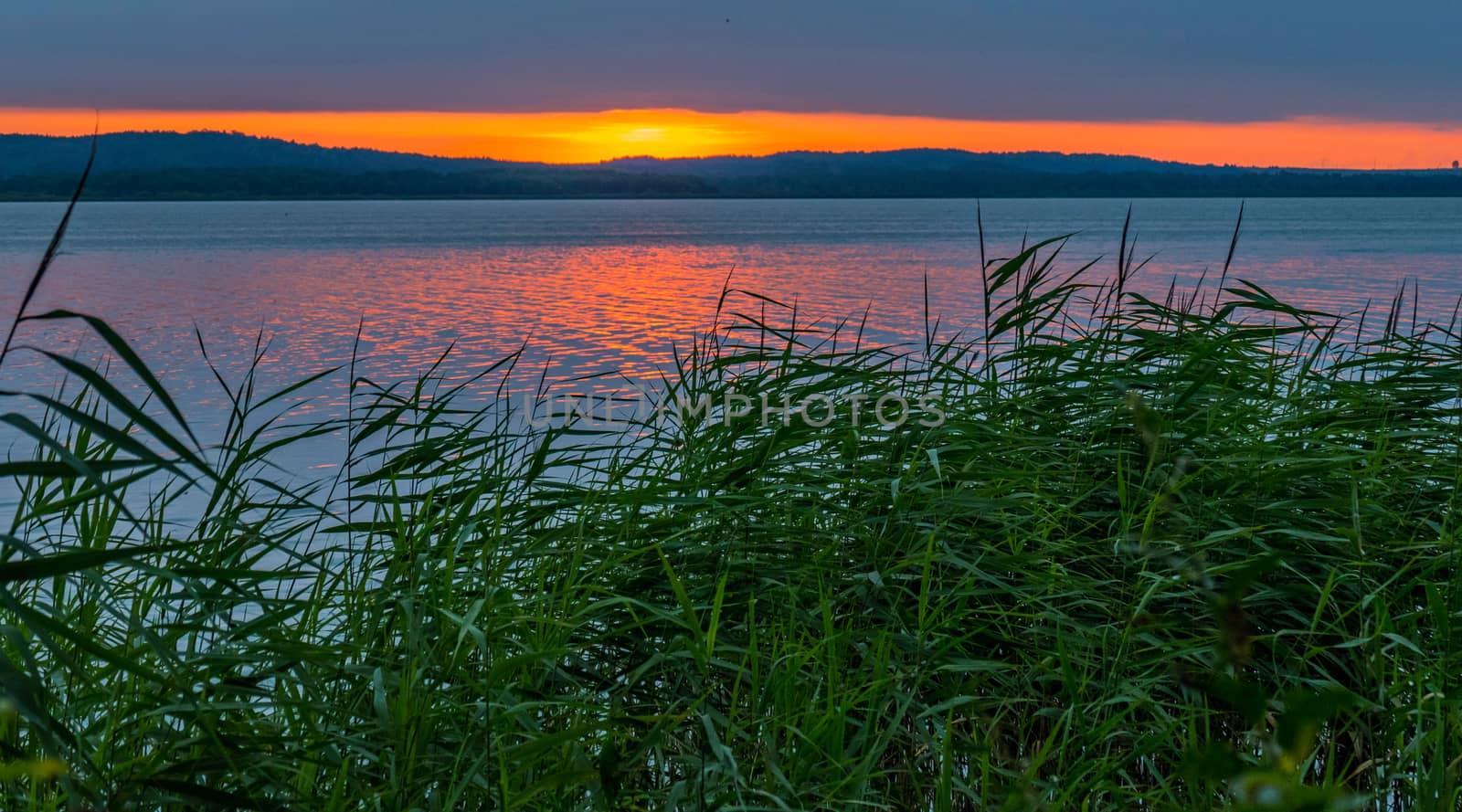 calm sea on the background of a beautiful fire sunset