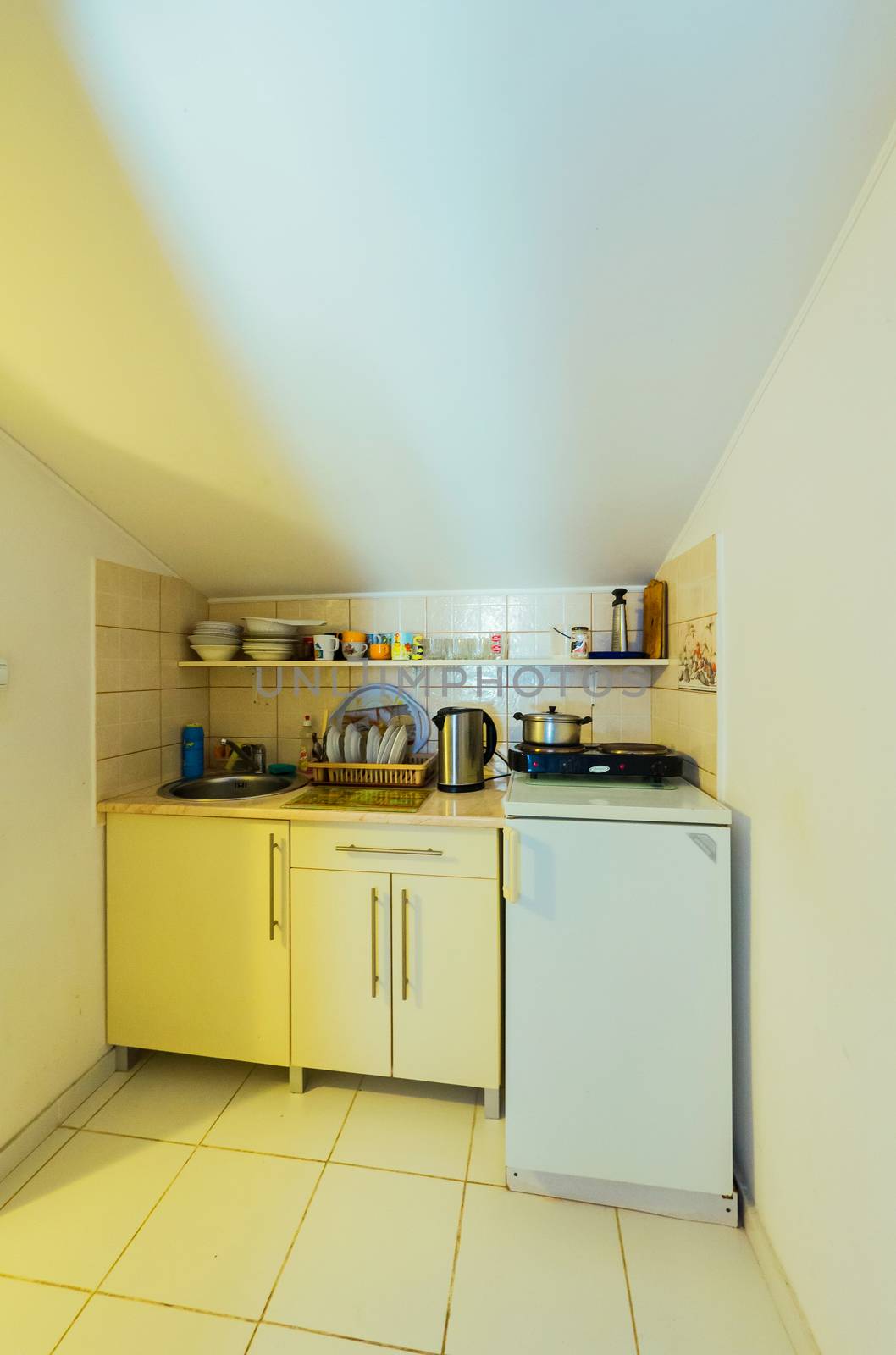 A small cozy kitchen in light colors by Adamchuk