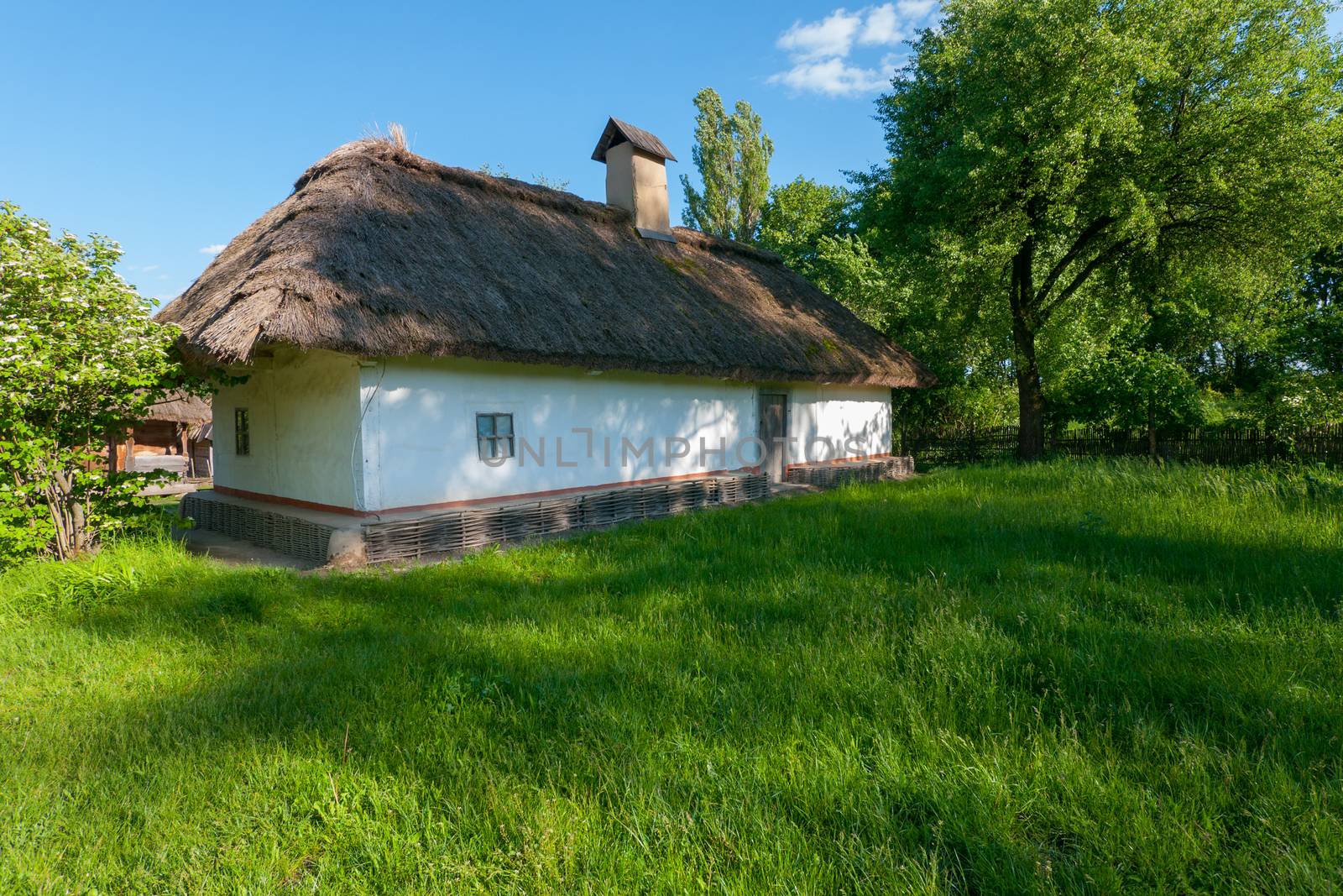 An old hut of Smoker Cretaceous with a reed and with an unbreakable foundation in the museum under the loose sky. Uzhhorod Ukraine by Adamchuk