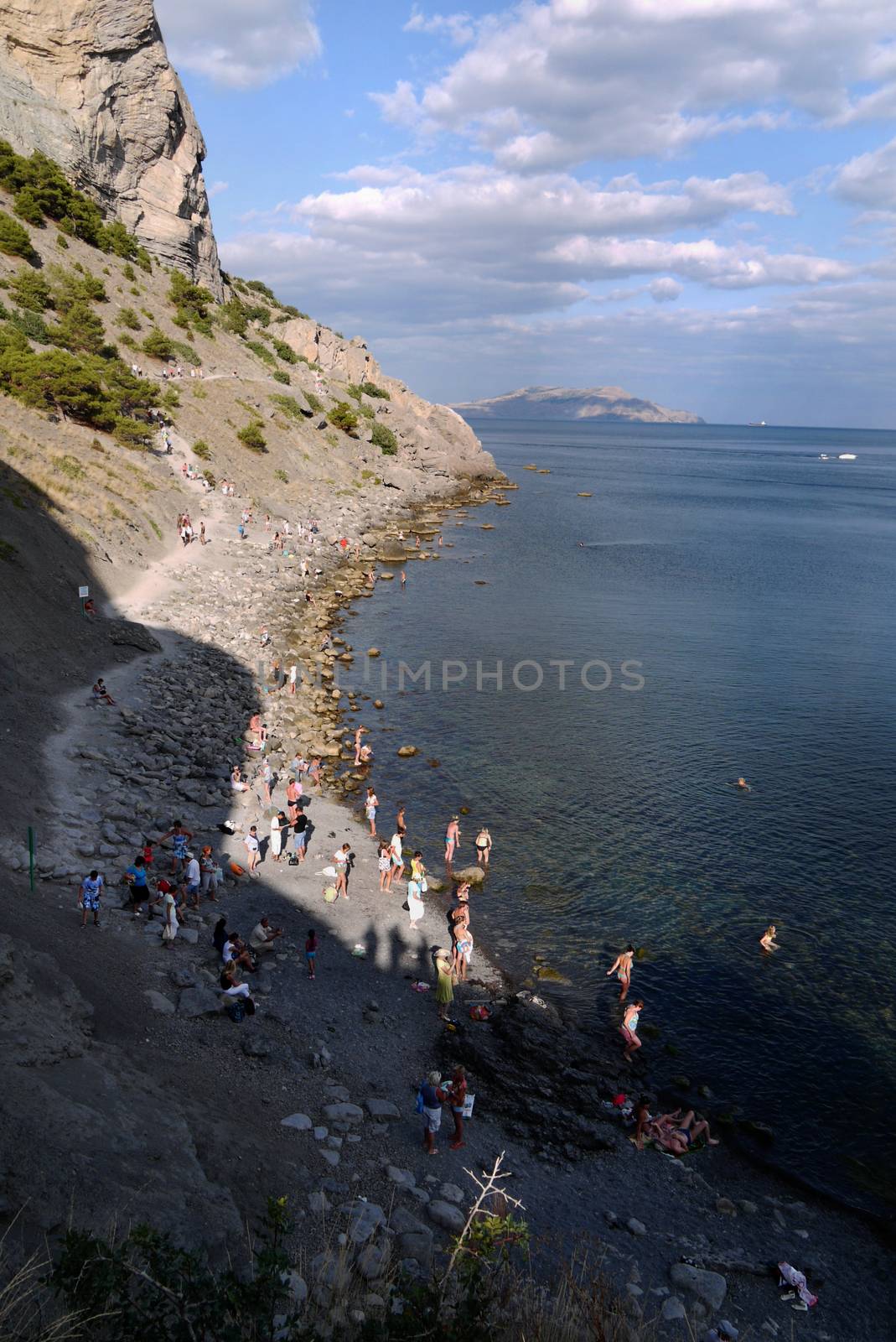 beautiful Crimean slopes on the shore of the Black sea.Tipping on the beach by Adamchuk