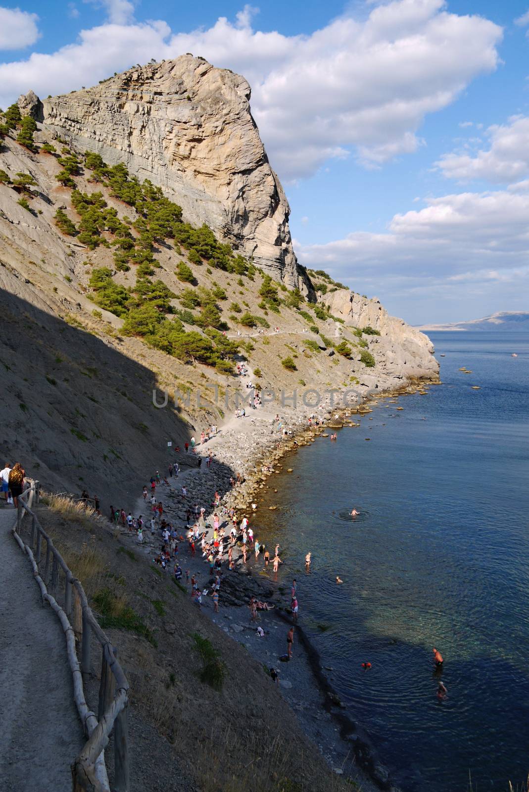 beautiful Crimean slopes on the shore of the Black sea.Tipping on the beach