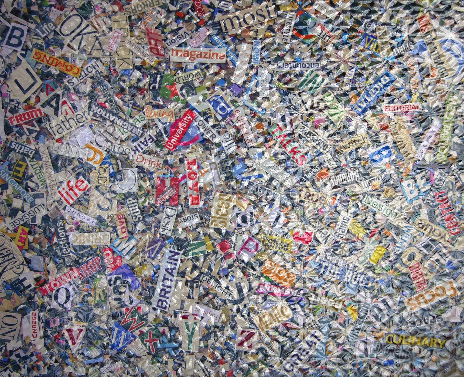 random  magazine letters  and words under a pice of textured glass 