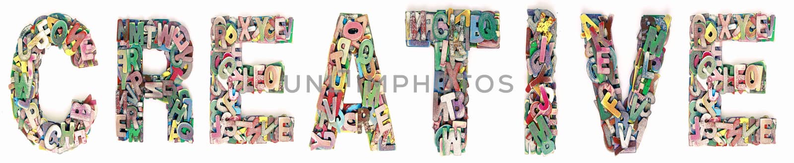 The word Creative made up of lots of  small wooden letters 