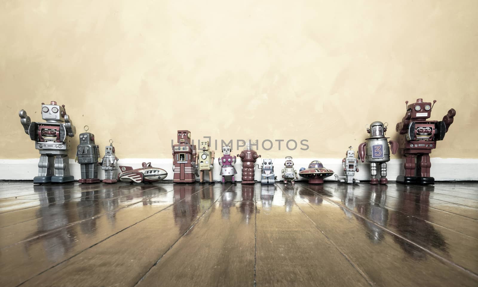 retro tin toys on a wooden floor 
