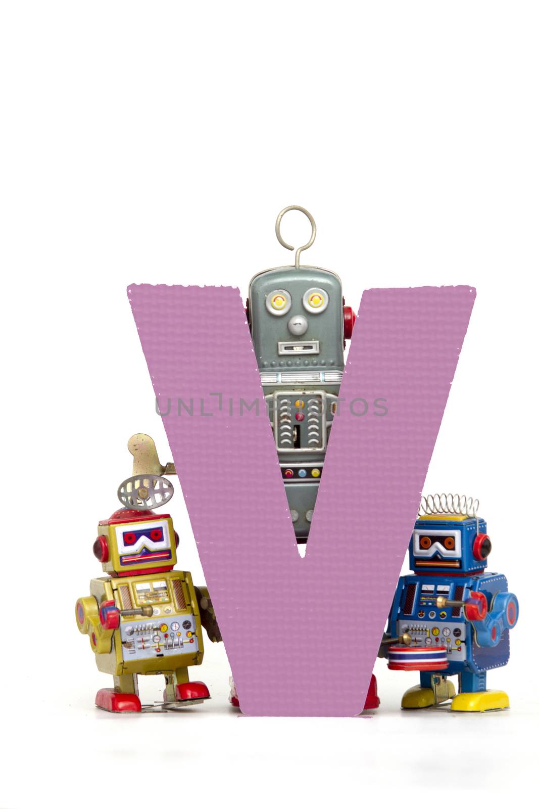 capital letter V  held by vintage robot toys 