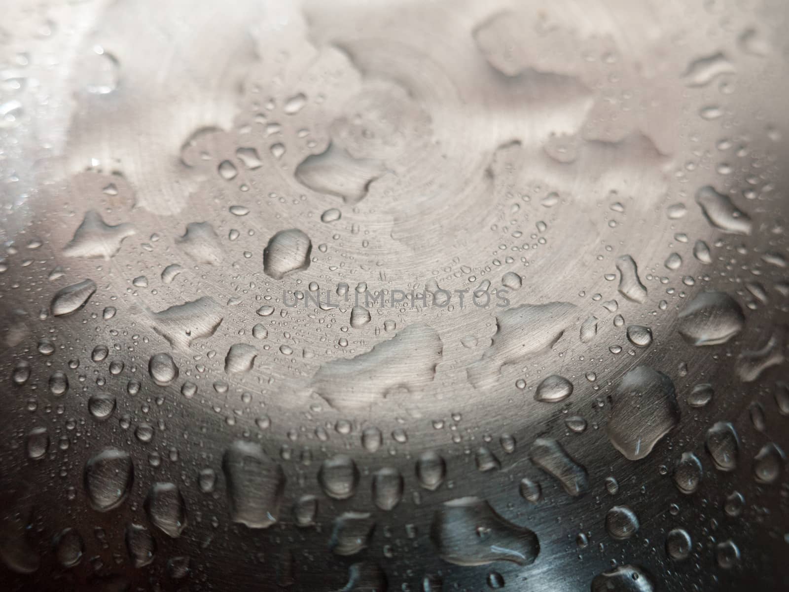 Water droplets on a shiny metal surface