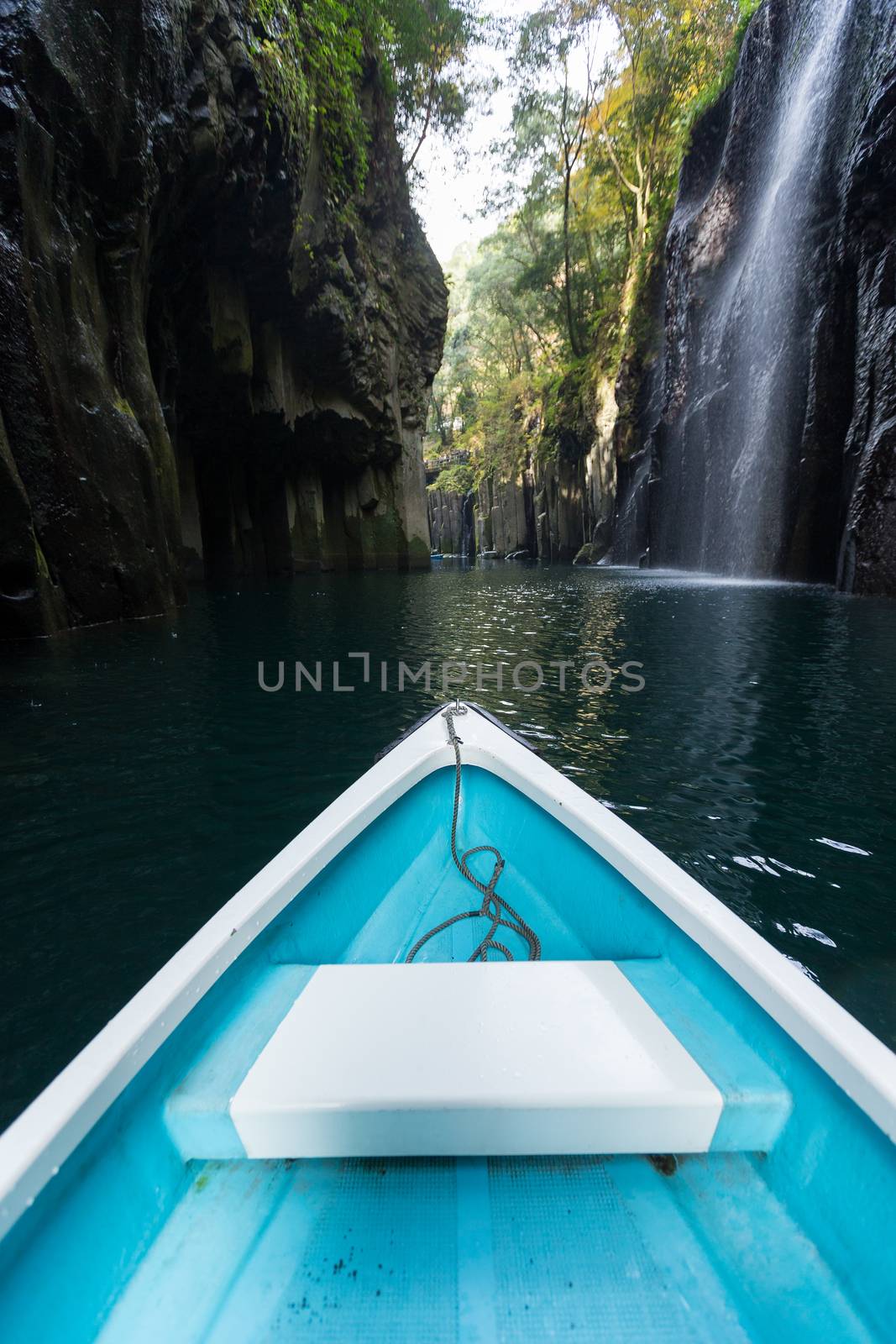 Small boat travel in Takachiho gorge by leungchopan