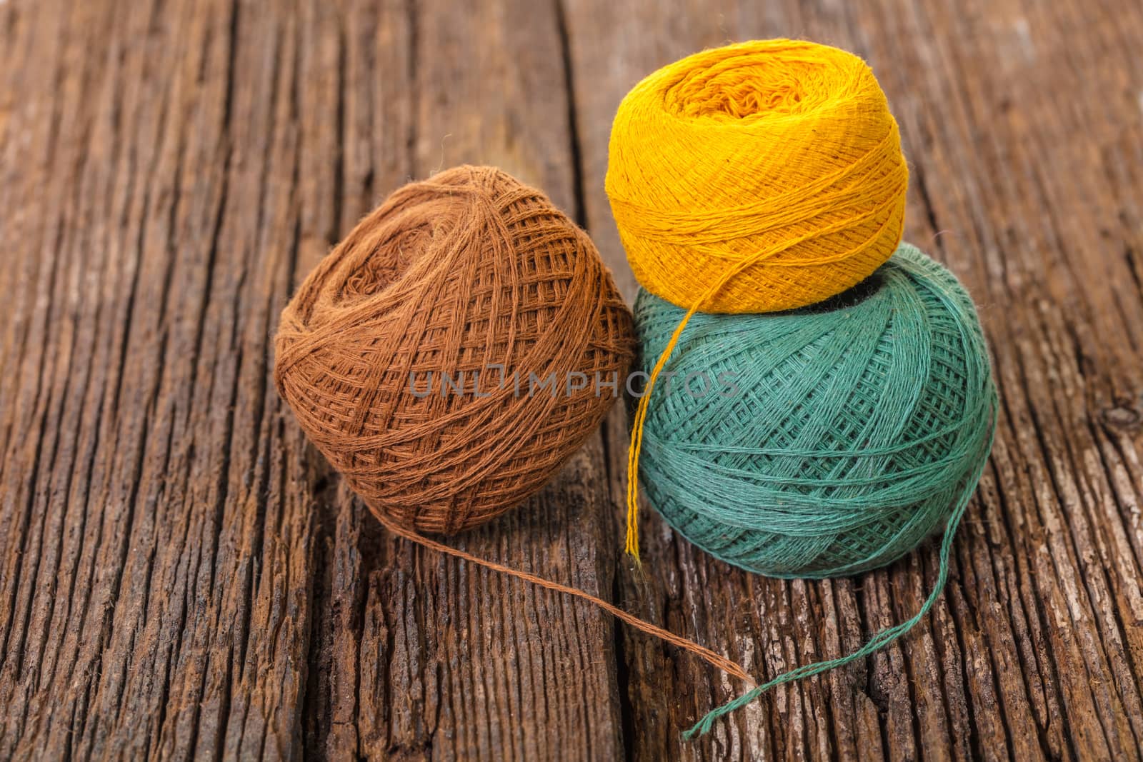 ball of thread for knitting on a wooden background