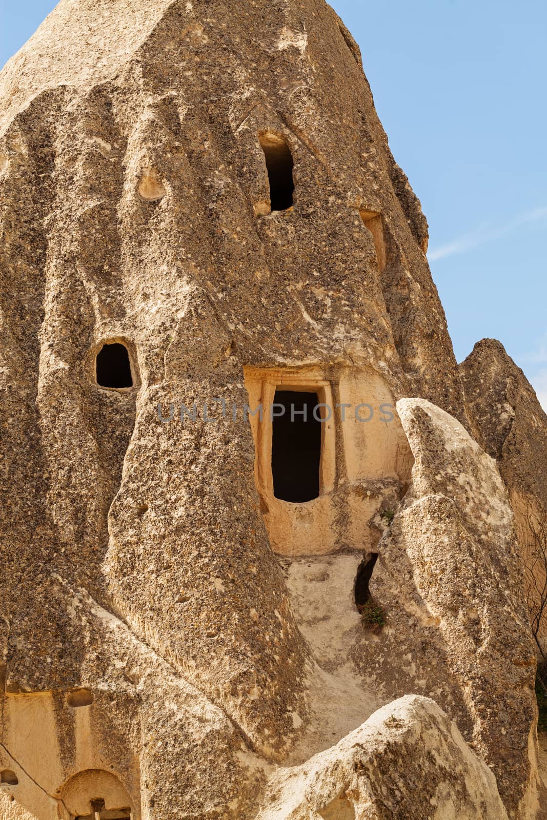 Cylindrical stone cliffs and cave houses near Goreme, Turkey