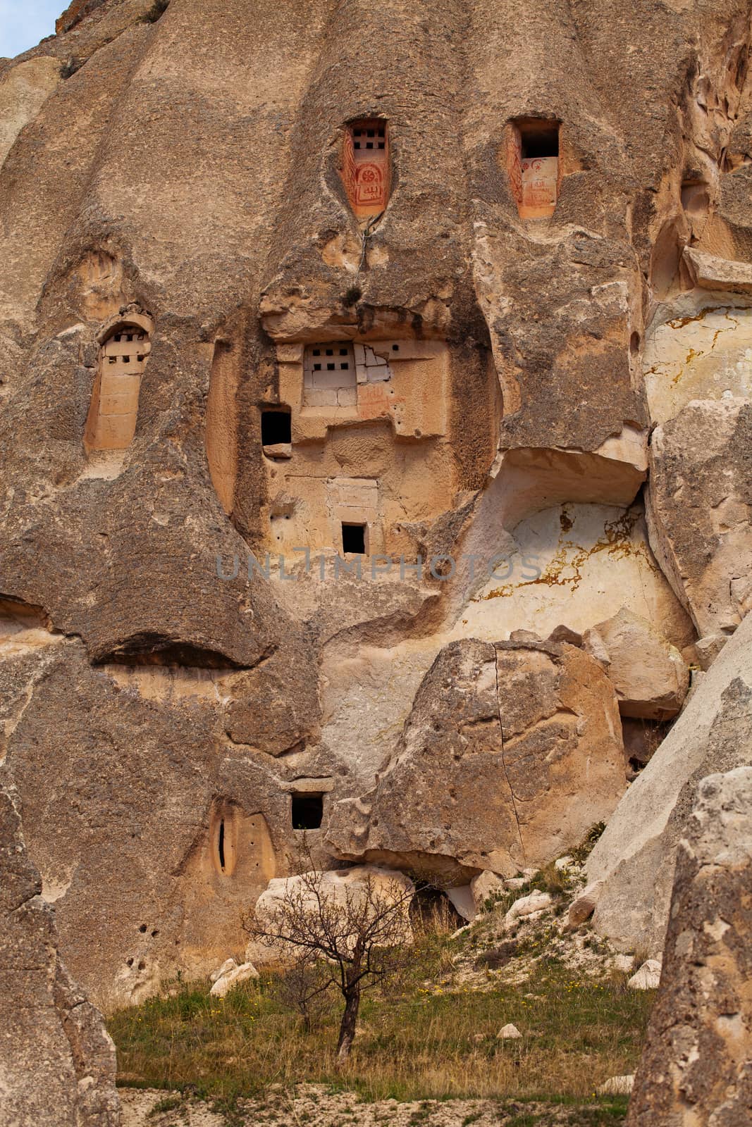 Cylindrical stone cliffs and cave houses near Goreme, Turkey