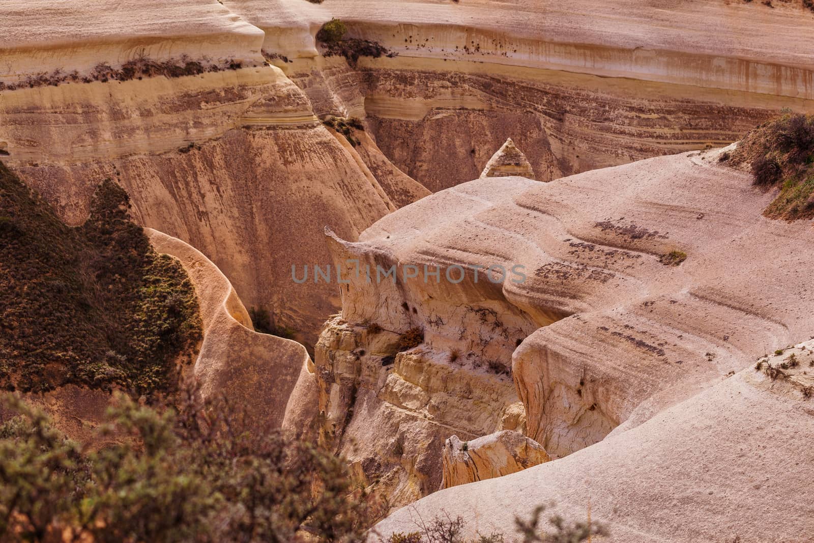 Beautiful stone cliffs in valley named Rose valley near Meskendir, Goreme, Turkey