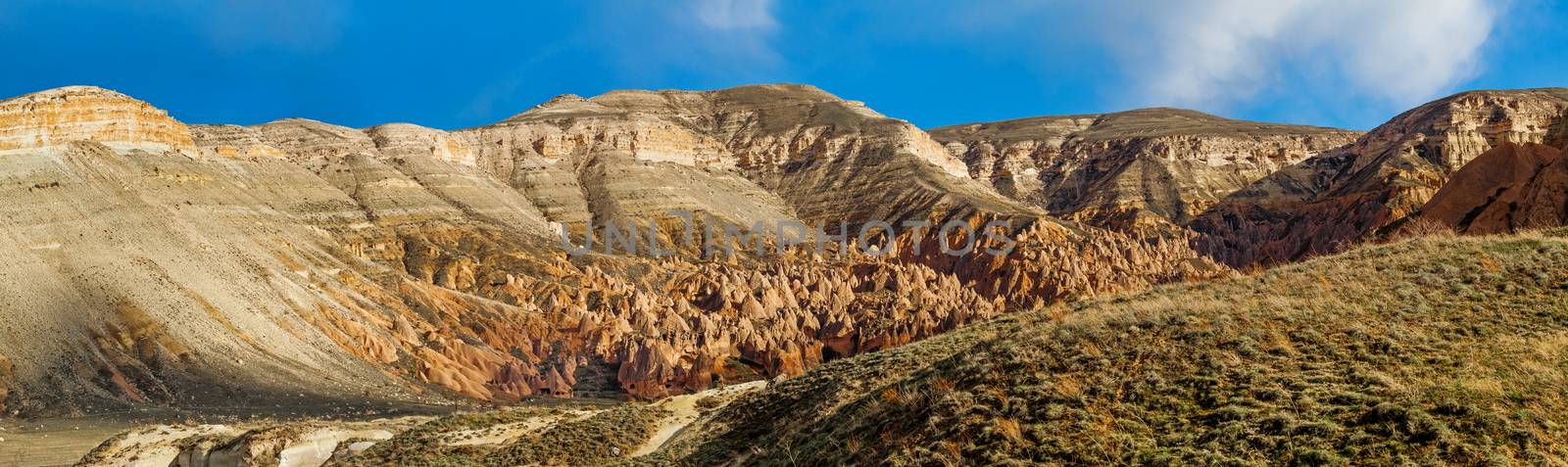 Beautiful stone cliffs in valley named Rose valley near Meskendir, Goreme, Turkey