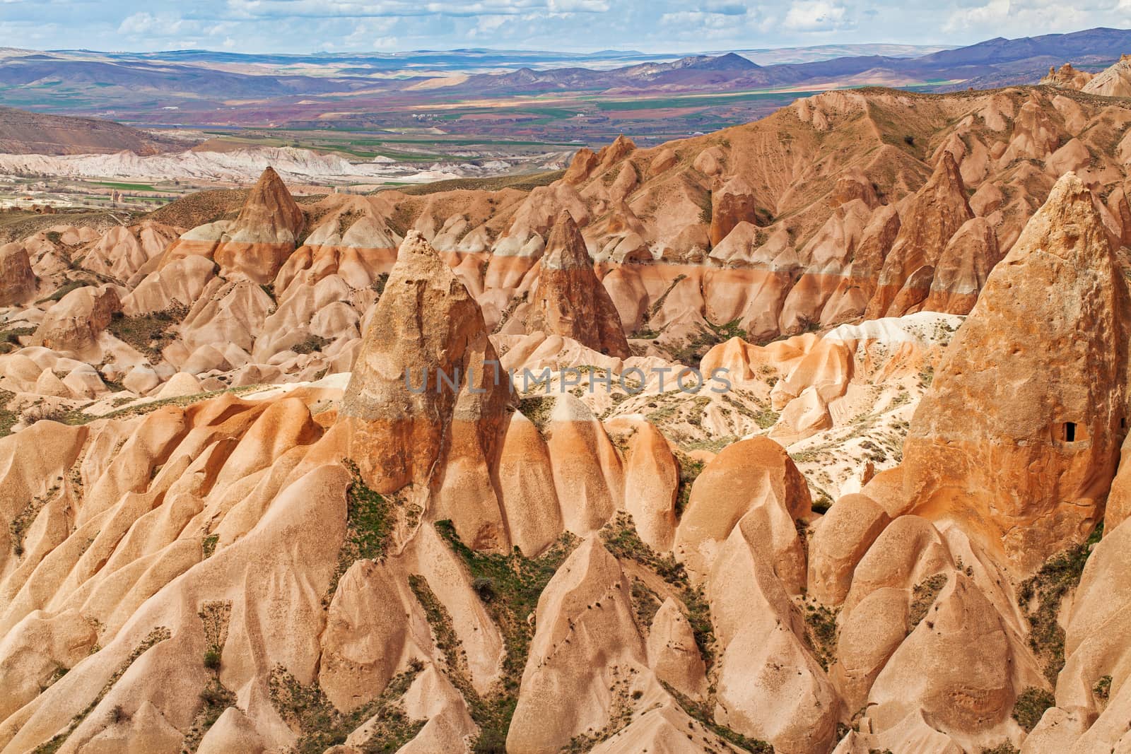 Beautiful stone cliffs in valley named Rose valley near Meskendir, Goreme, Turkey