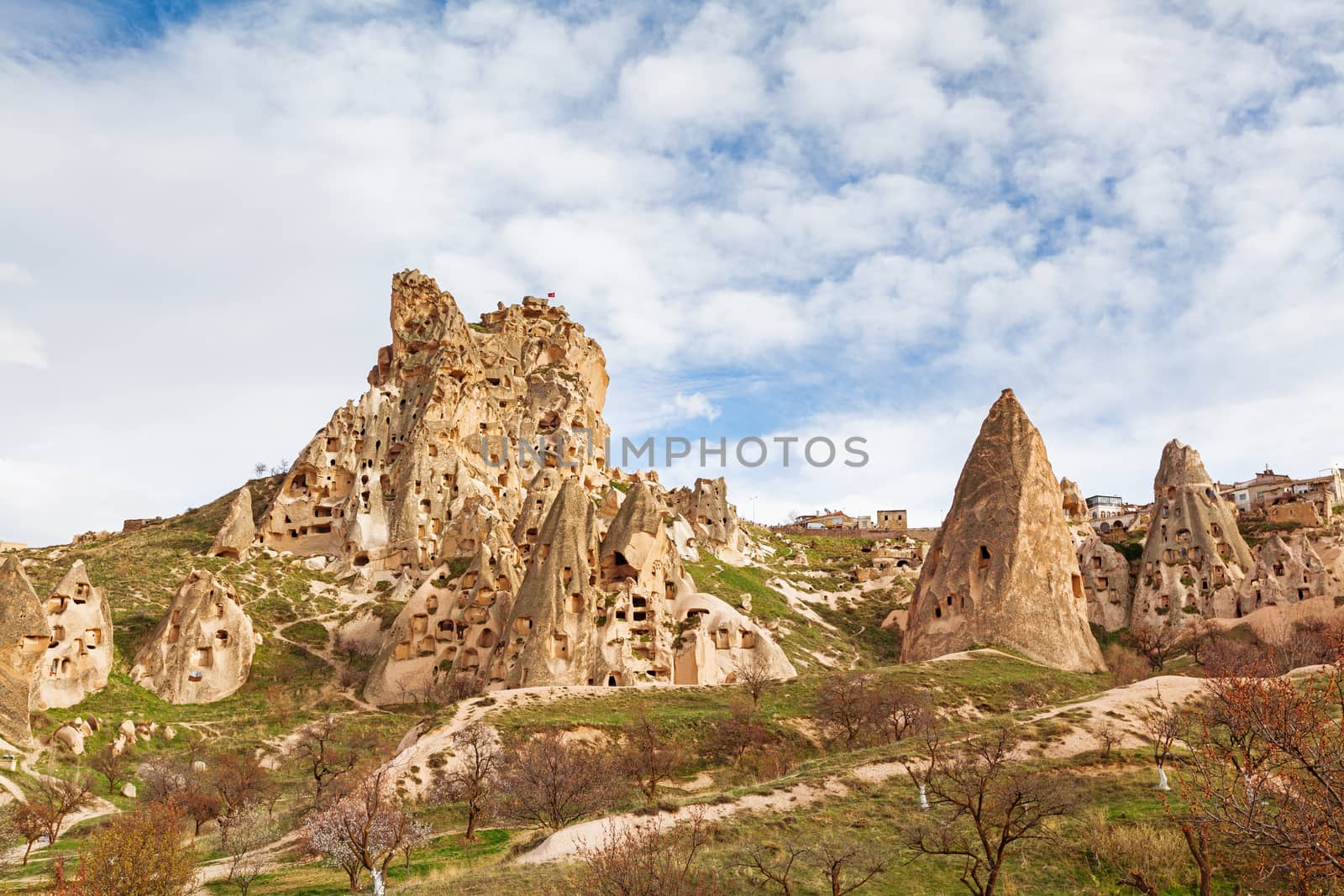 Stone cliffs and cave houses in Uchisar near Goreme, Turkey