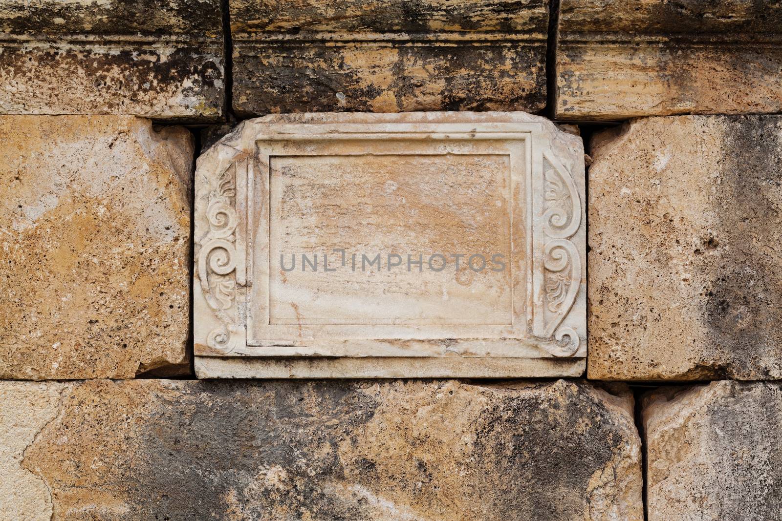 Texture of stone wall in ancient city Hierapolis, near Pamukkale, Turkey