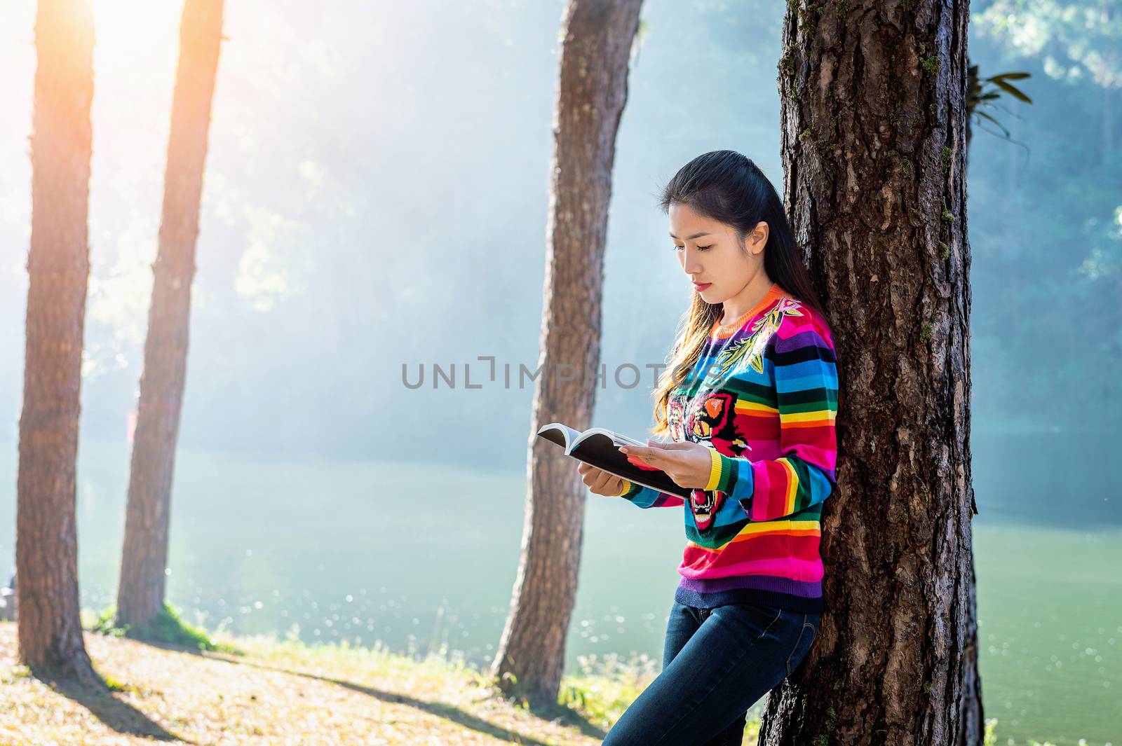 Beautiful girl in forest reading a book. by gutarphotoghaphy