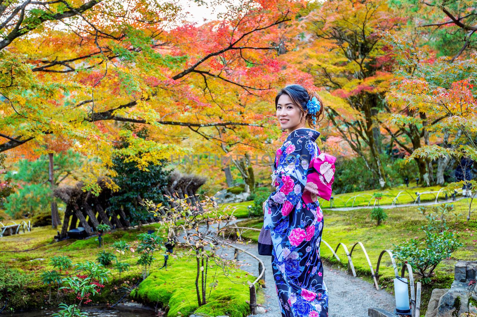 Asian woman wearing japanese traditional kimono in autumn park. by gutarphotoghaphy