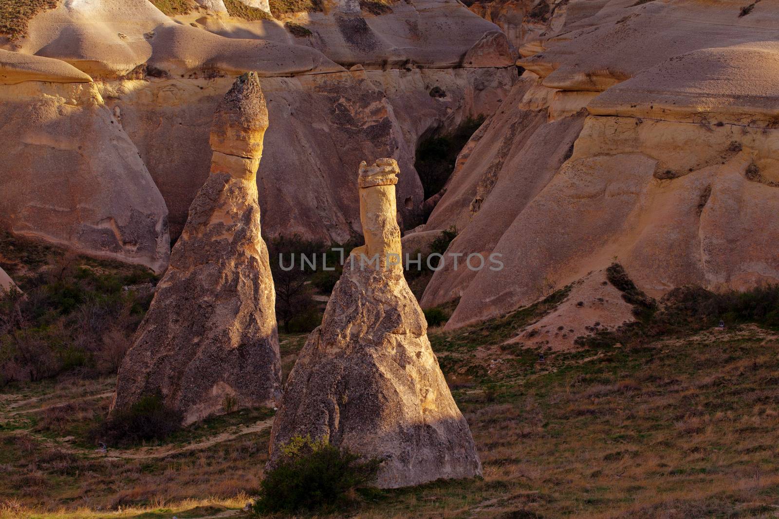 Cylindrical stone cliffs and cave houses near Goreme, Turkey