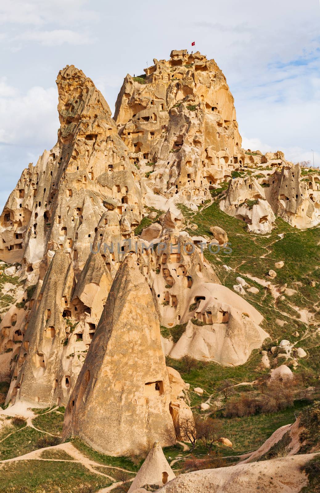 Stone cliffs and cave houses in Uchisar near Goreme, Turkey
