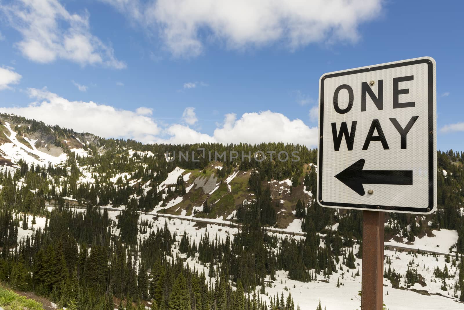 One Way drive along highway in scenic Mount Rainier National Park Washington State