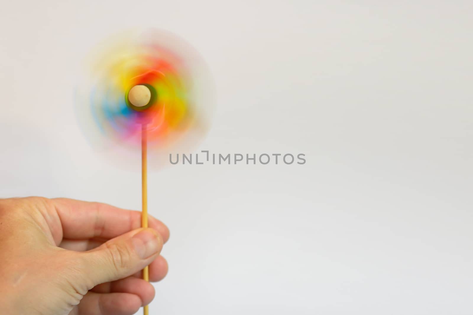 Toy Multi-colored windmill and hand